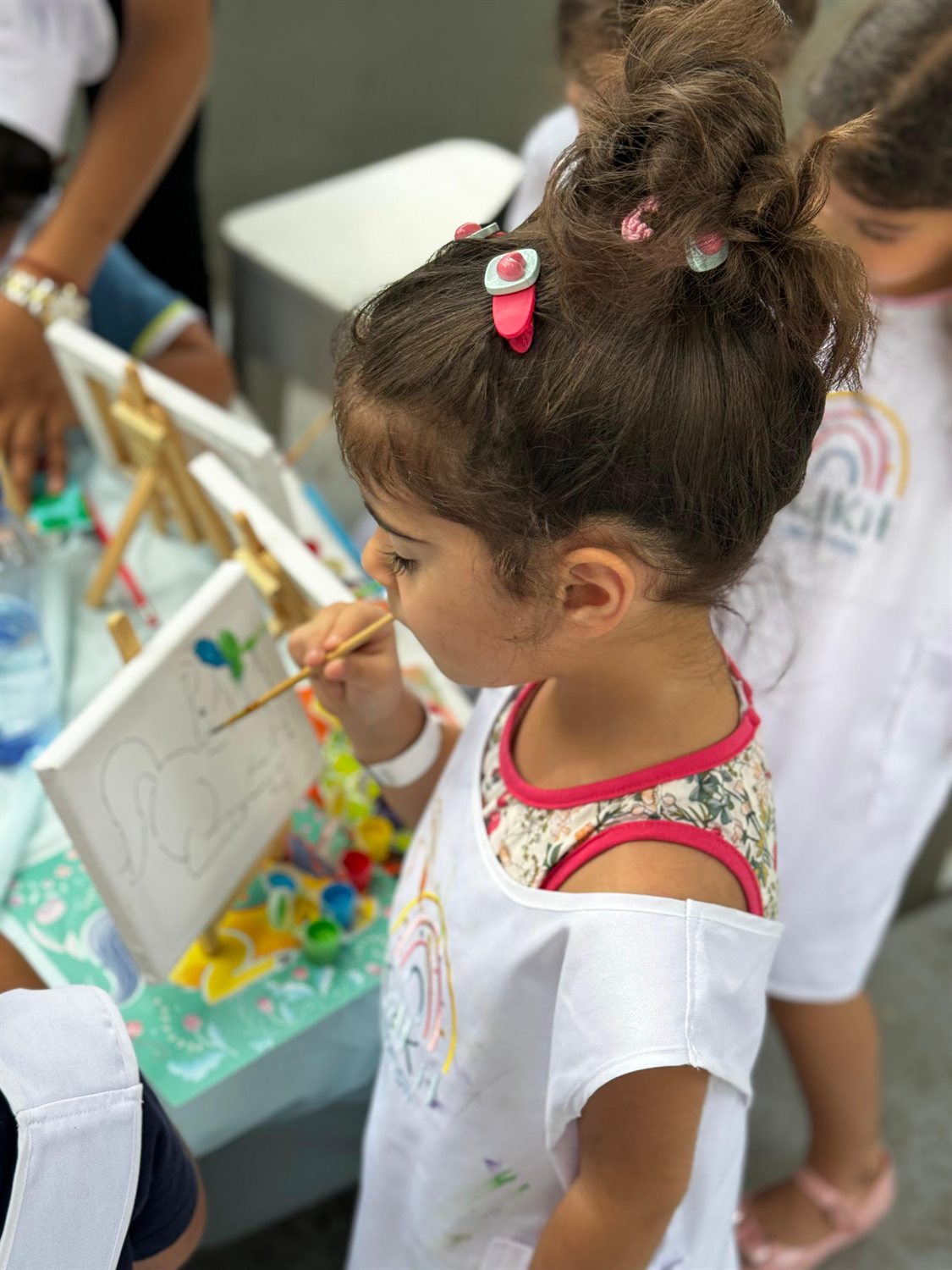Children painting at a creative workshop